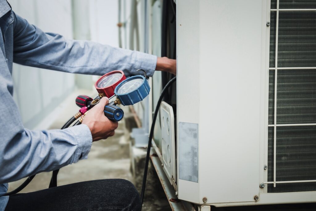 Repairman doing HVAC maintenance in Austin