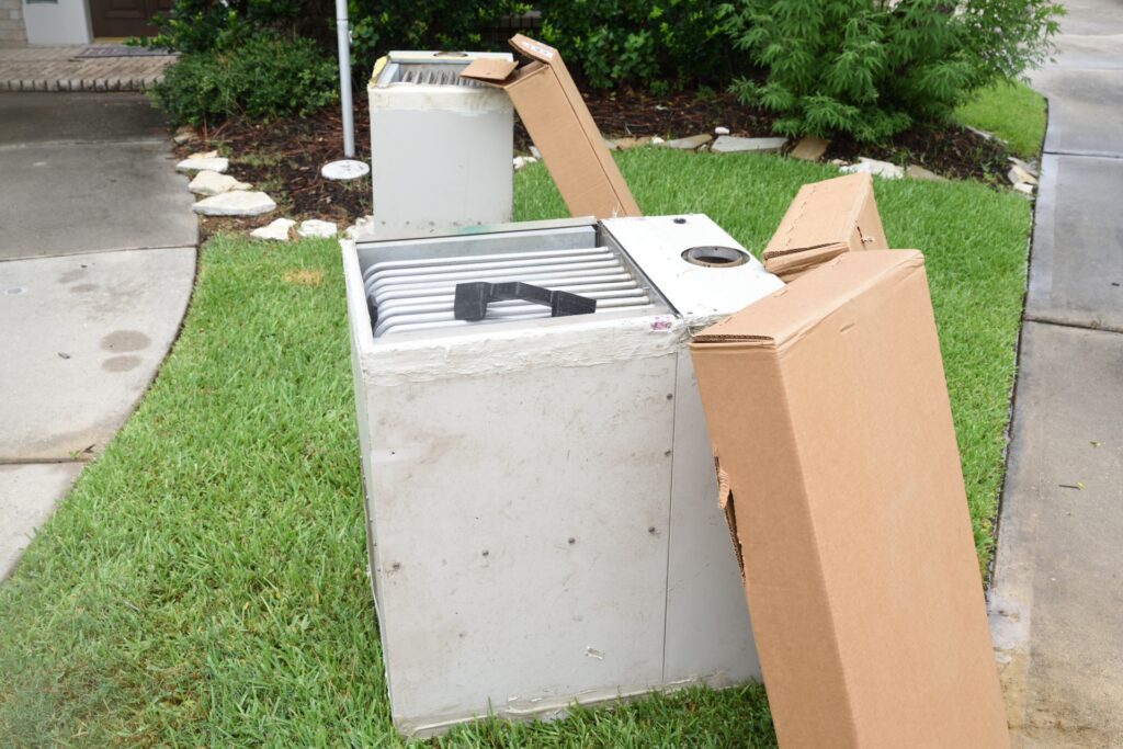 Old heaters sitting outside after an HVAC replacement